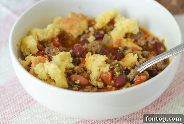 Full spread of chili with various toppings and sides