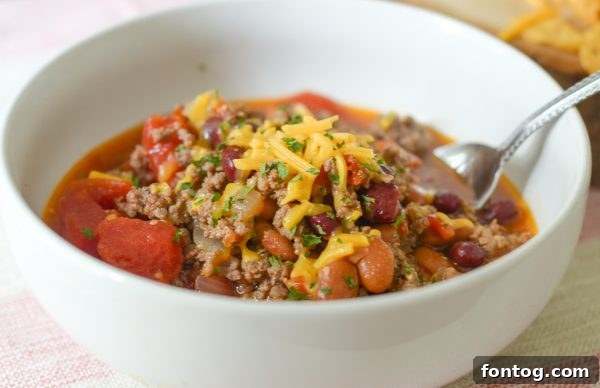 A top-down view of the Instant Pot Hearty Bean Chili with a rich, dark color