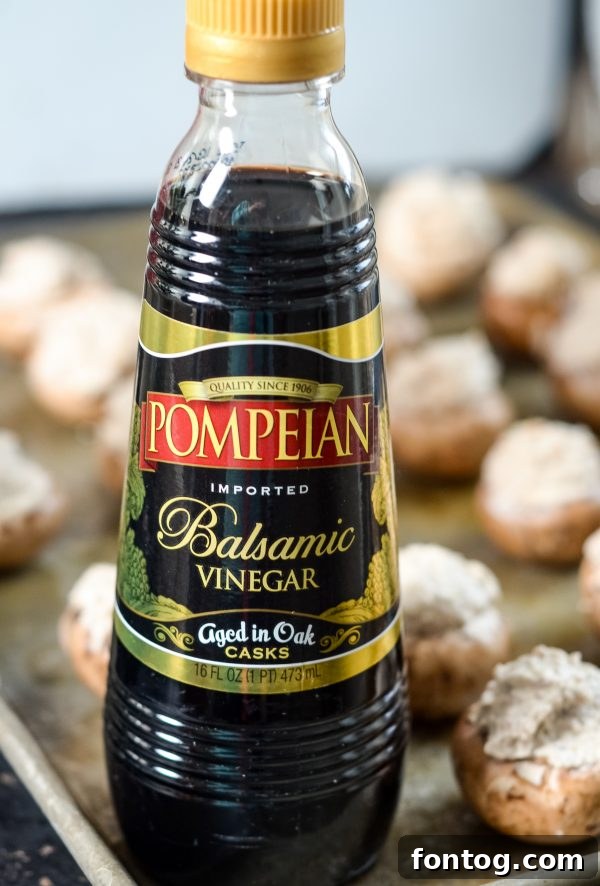 Balsamic Kissed Stuffed Mushrooms 3 Close-up of golden brown Balsamic Glazed Stuffed Mushrooms, ready to serve.