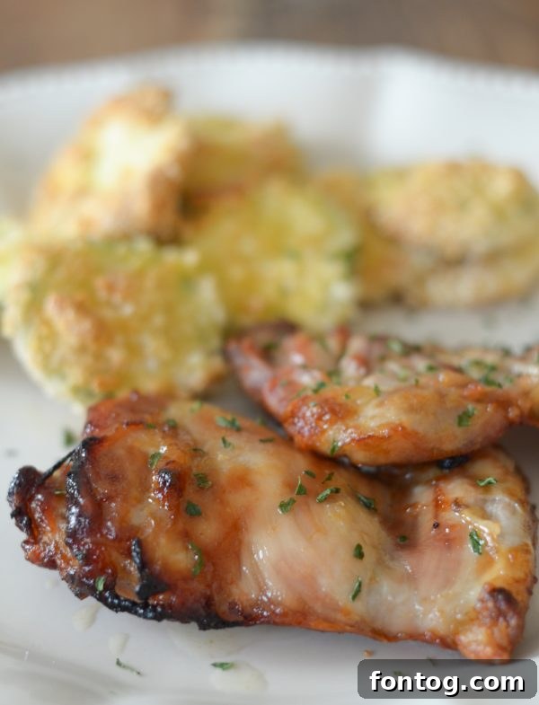 Air Fryer Glazed Chicken Thighs ready to be served with a vibrant side dish.