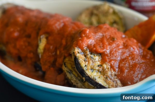 Comforting Gluten Free Eggplant Parmigiana 6 Assembled layers of eggplant, marinara, and mozzarella for Eggplant Parmigiana before baking