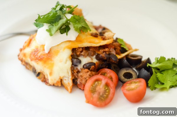 Serving Gluten-Free Mexican Lasagna with fresh toppings