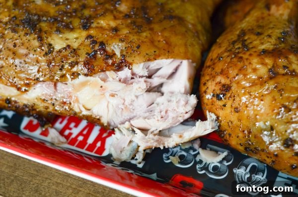 Juicy Smoked Chicken Quarters on a cutting board