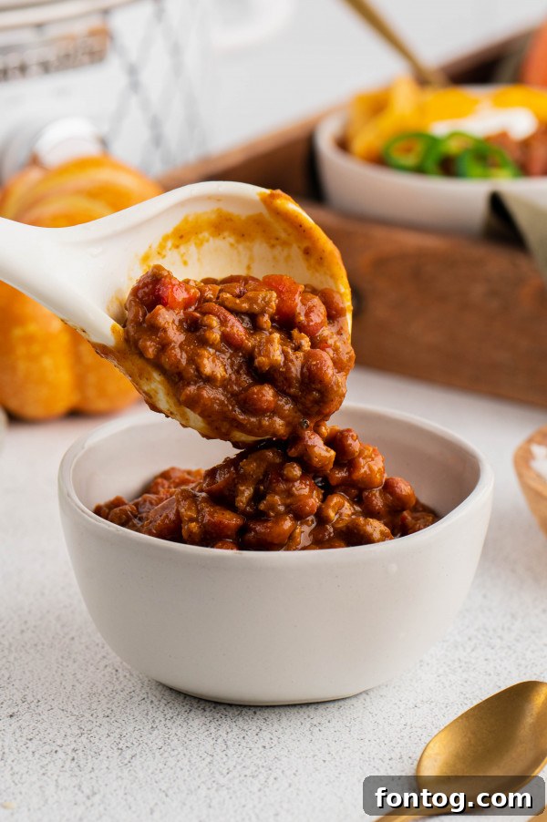 Close-up of hearty Instant Pot Pumpkin Chili, steaming hot and ready to be enjoyed.