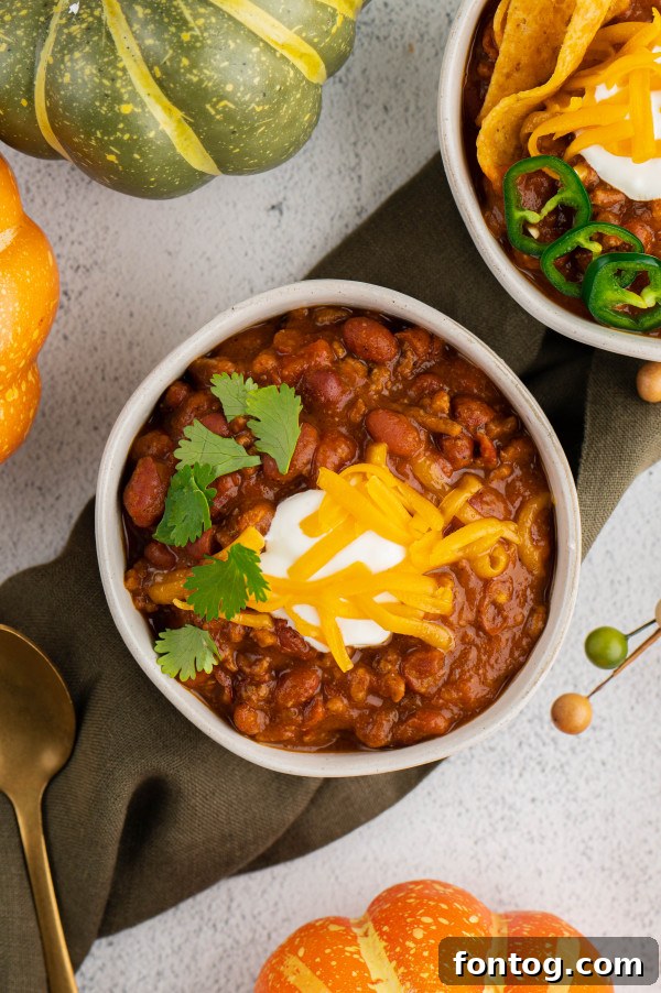 Instant Pot Pumpkin Chili garnished with a variety of fresh ingredients, ready for serving.