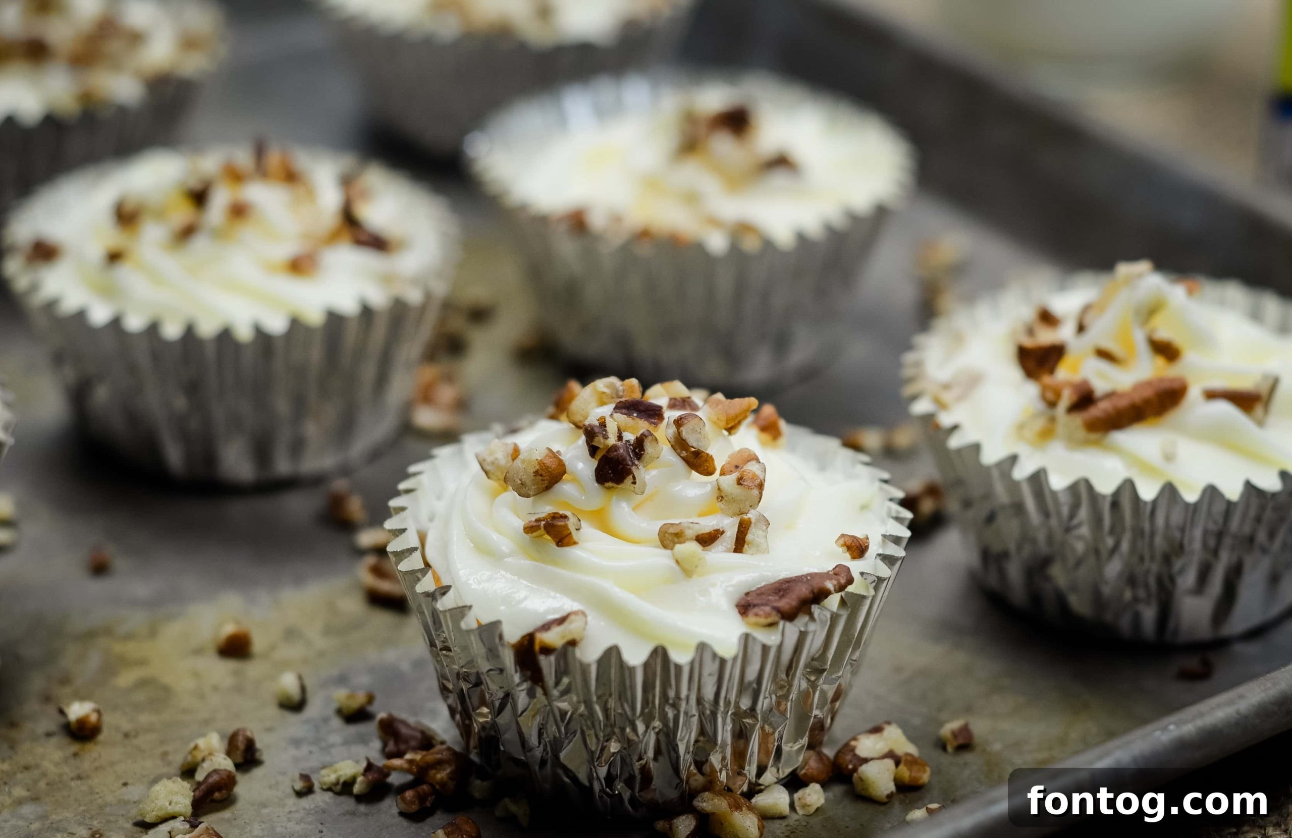 Spiced Gluten-Free Pumpkin Pie Cupcakes 11 Delicious Gluten Free Pumpkin Pie Cupcakes, garnished with pecans