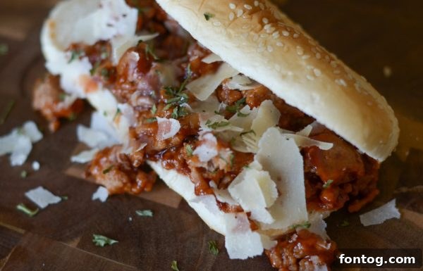 Delicious Tangy Turkey Sloppy Joes served on toasted buns with side pickles