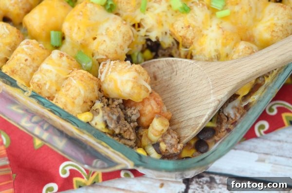 Hearty Tater Tot Taco Casserole baked to golden perfection with melted cheese