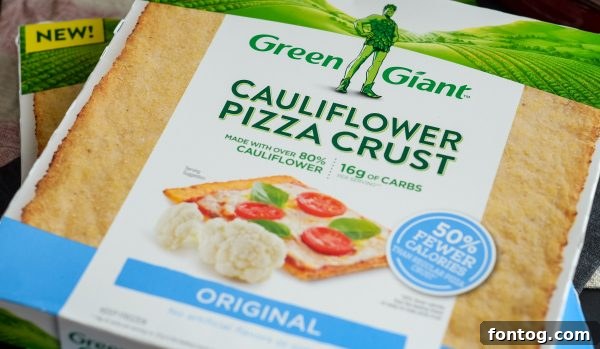 Spread of holiday food including a cauliflower crust pizza and cauliflower stuffing