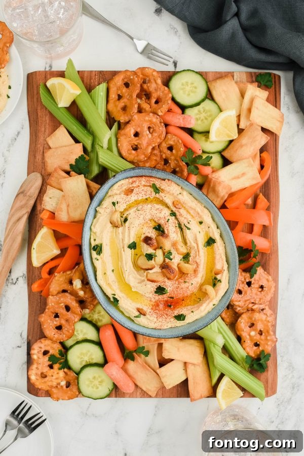 Roasted garlic hummus with pita bread, a healthy appetizer.