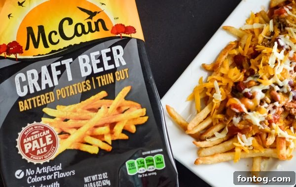 Beer Battered Nacho Chili Cheese Fries being prepared