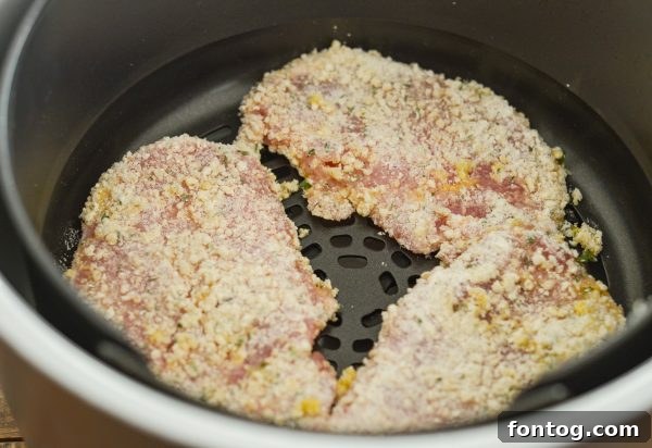 Ingredients for Air Fryer Ranch Breaded Pork Chops on a white board