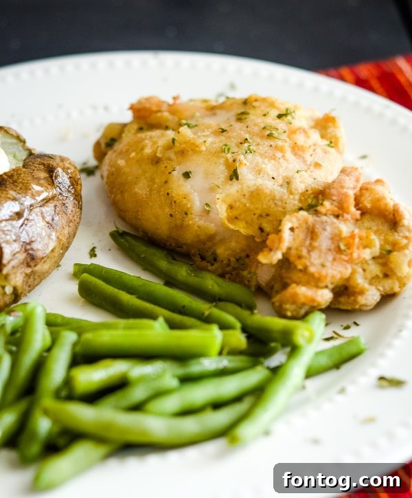 Close-up of golden-brown gluten-free air fried chicken, highlighting its crispy texture.