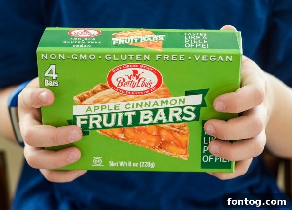 A Betty Lou's Fruit Bar accompanied by fresh fruit, showcasing a healthy and appealing snack.