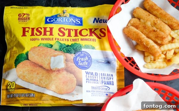 Gorton's fish sticks beautifully plated with a side of chips, ready to be enjoyed as a family meal.