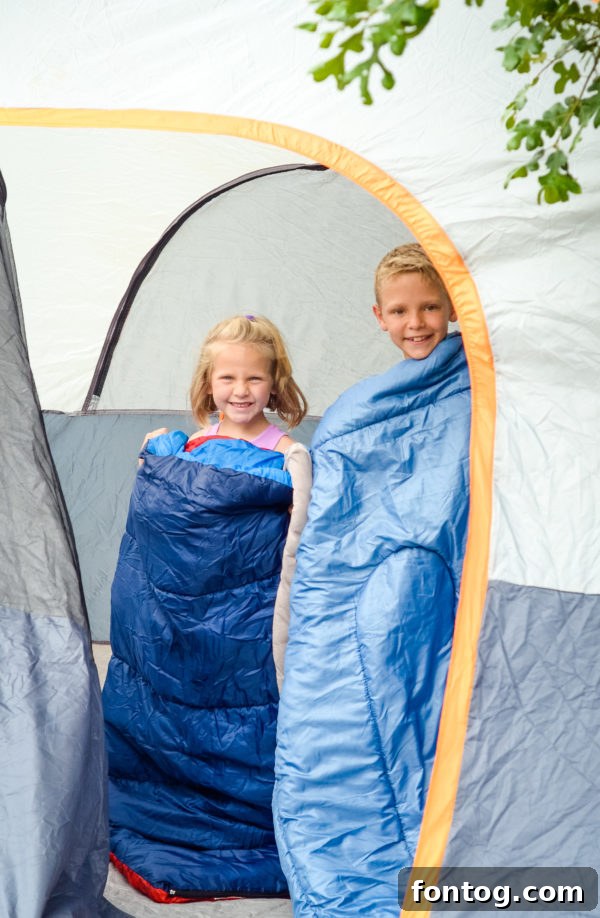 Kids setting up a tent for backyard camping adventure