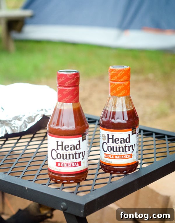Head Country BBQ sauce bottles ready for campfire cooking