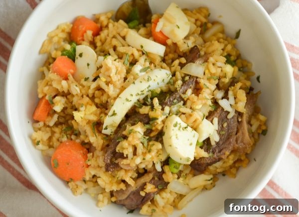 Air Fryer Beef Fried Rice beautifully mixed with scrambled eggs and tender beef