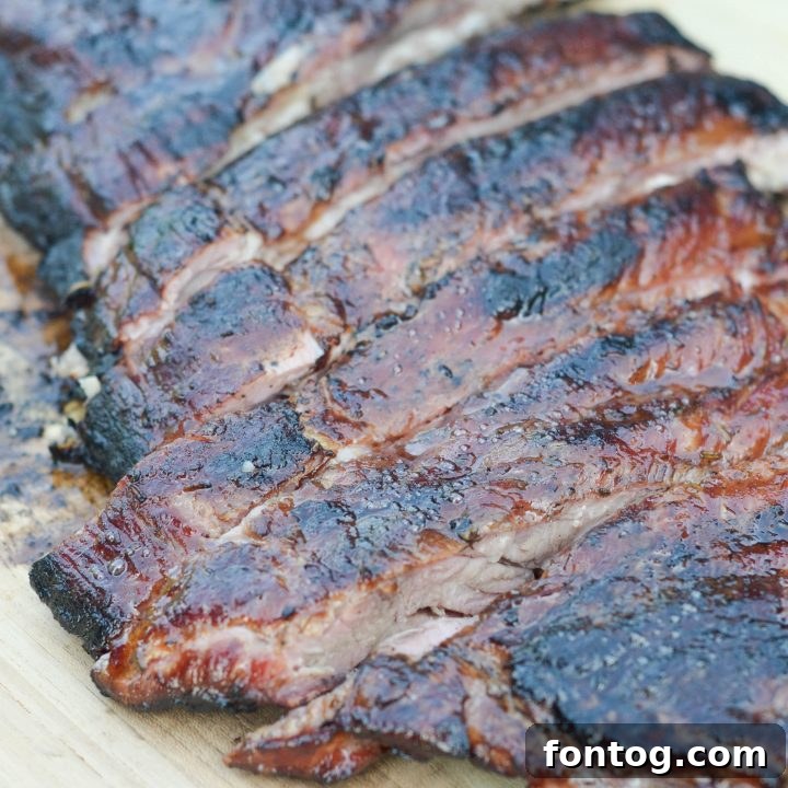 Perfectly cooked Maple Glazed Ribs on a platter.