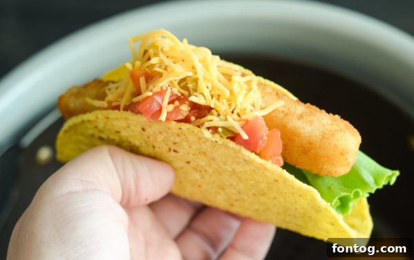 Air fryer basket filled with perfectly cooked Gorton's Fish Sticks, ready to be served