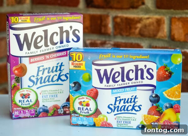 Close-up of the No-Bake Sweet & Salty Snack Mix showing Welch's Fruit Snacks, marshmallows, chocolate chips, and pretzels.