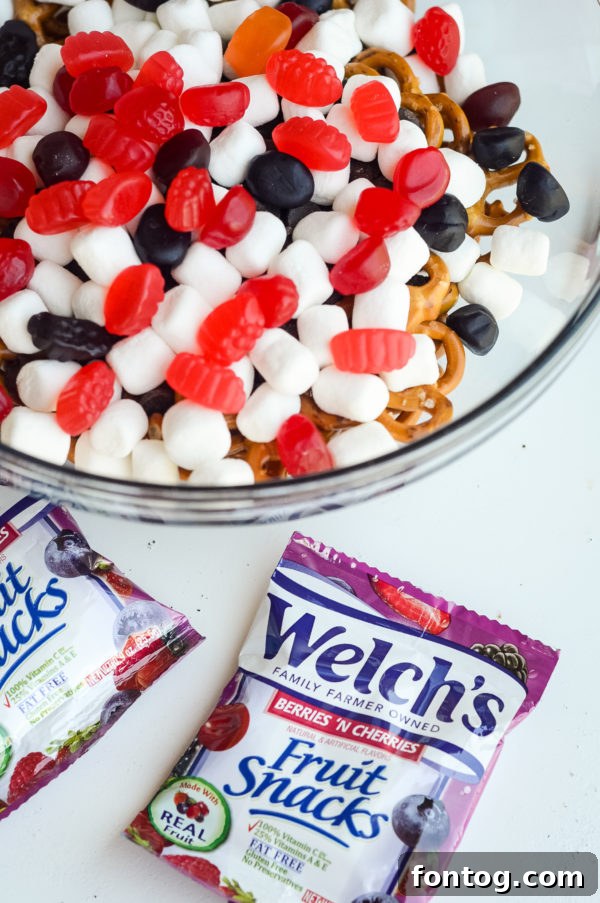 A full bowl of the completed No-Bake Sweet & Salty Snack Mix, showcasing its appealing texture and mix of ingredients.