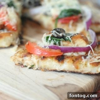 Grilled Rustic Chicken Pizza with Pompeian olive oil, a smoky and fresh pizza recipe for outdoor cooking.