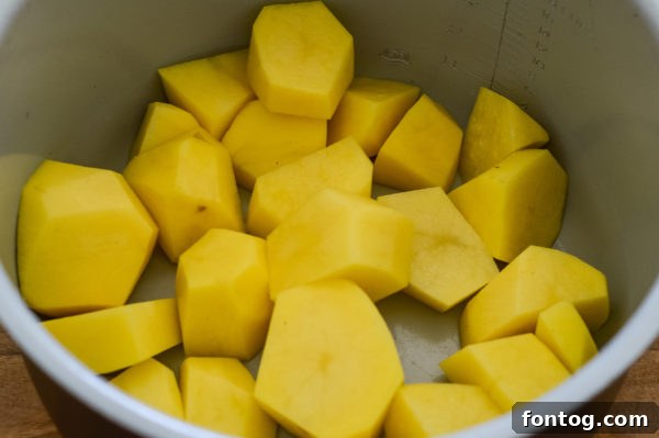 Ninja Foodi meatloaf and mashed potatoes cooking together