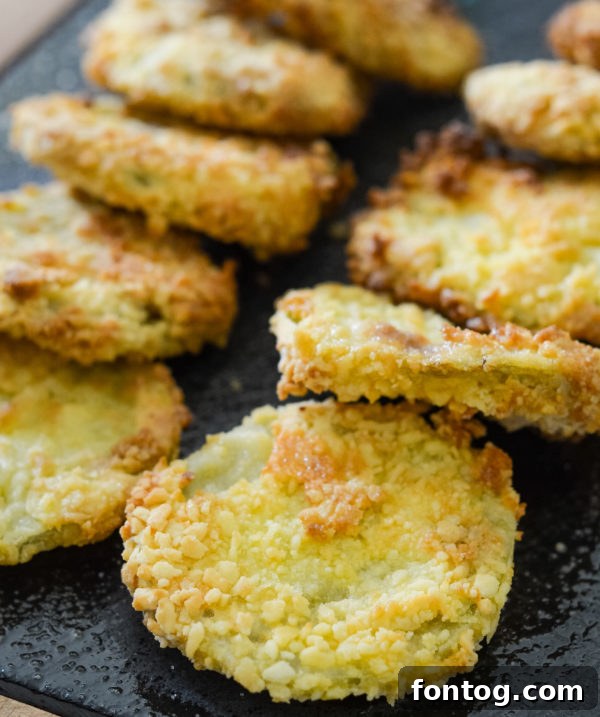 Crispy Gluten-Free Air Fryer Fried Green Tomatoes 2 Air Fryer Fried Green Tomatoes on a plate, golden and crispy