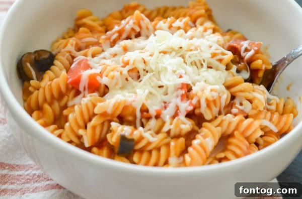 Ninja Foodi Pizza Pasta in a bowl, ready to serve with fresh basil