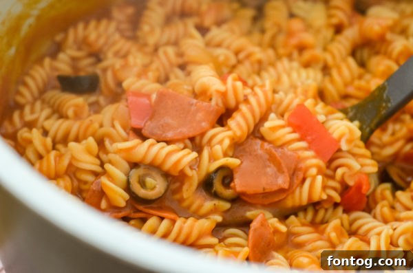 Ninja Foodi Pizza Pasta in the pot, ready to be cooked