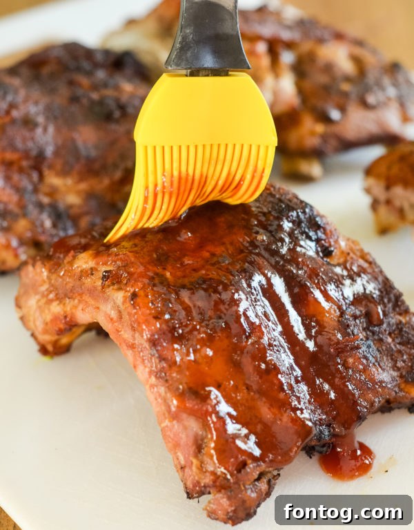 Perfectly cooked Ninja Foodi Baby Back Ribs with BBQ sauce