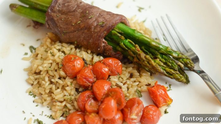 Steak Wrapped Asparagus on a plate.