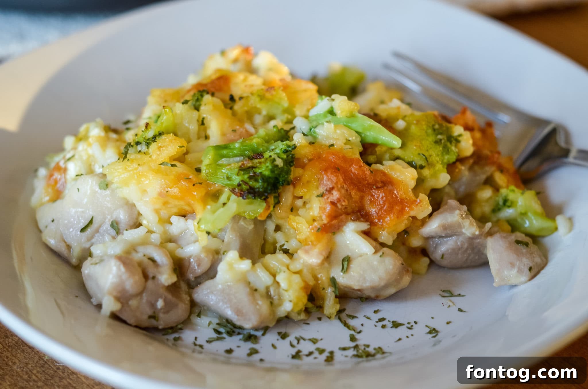 Ninja Foodi Cheesy Broccoli Chicken and Rice Bake on a white plate