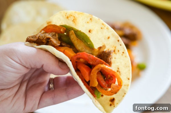 Cooked Air Fryer Beef Fajitas with tender beef strips and vibrant vegetables.