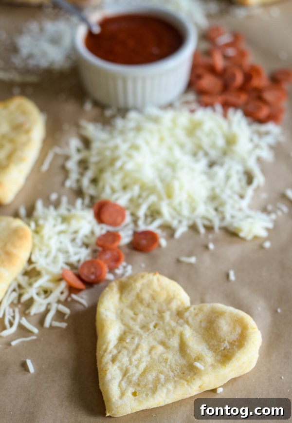 Heart-shaped air fryer pizza crusts in a prepared lunch box