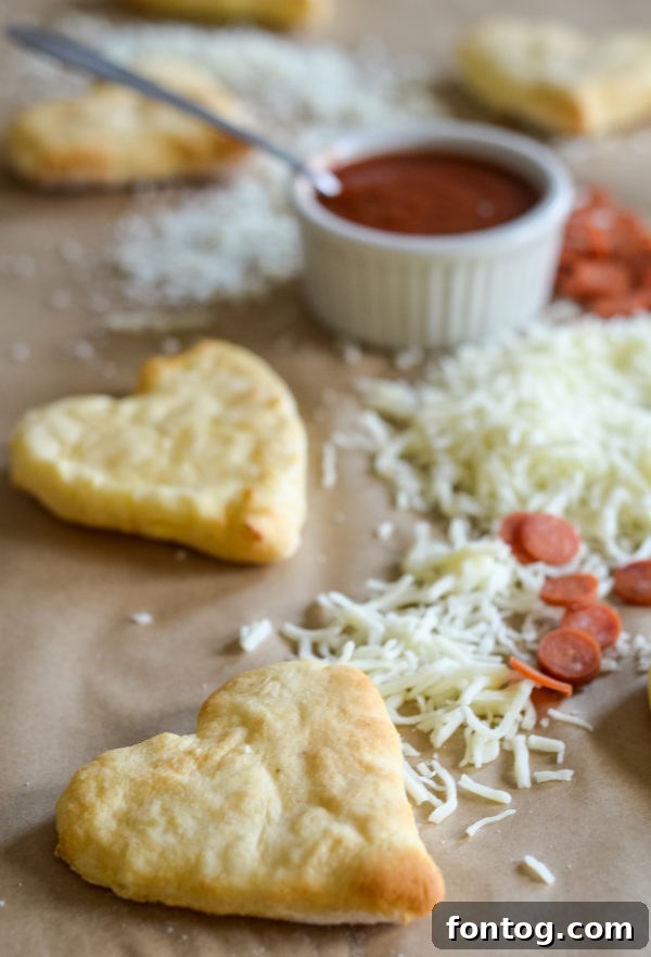 Components of a pizza lunch box kit with cheese, sauce, and pepperoni
