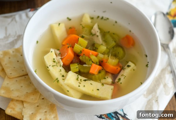 A comforting bowl of Ninja Foodi Chicken Noodle Soup, perfect for a weekly meal plan.