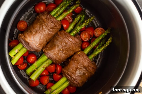 Ninja Foodi Steak Wrapped Asparagus, a savory Whole30 recipe.