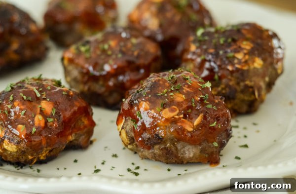 Cooked Ninja Foodi Tangy Meatballs with sauce and fresh herbs.