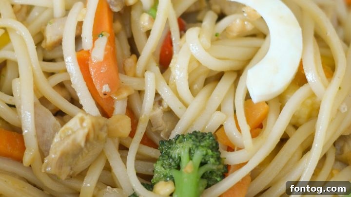 Gluten Free Chicken Pad Thai with noodles, chicken, and vegetables.