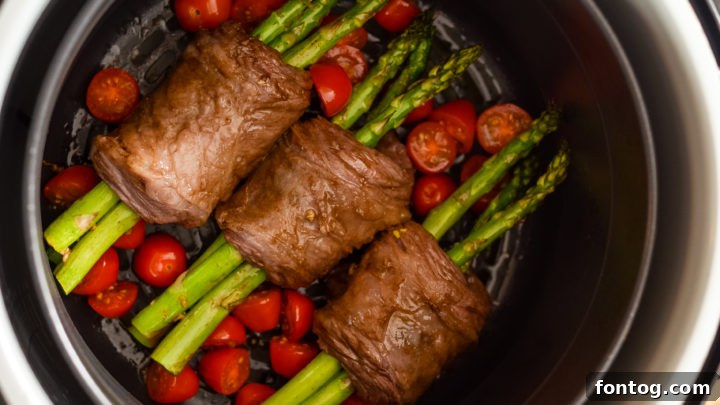 Elegant Ninja Foodi Steak Wrapped Asparagus, a low-carb gourmet dish.