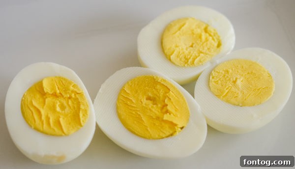 Perfectly hard-boiled eggs from the Ninja Foodi, ready for deviled eggs.