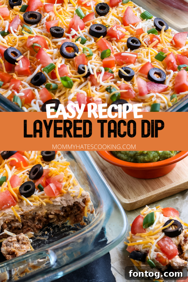 An overhead view of the completed layered taco dip in a large dish, surrounded by tortilla chips, ready for a party