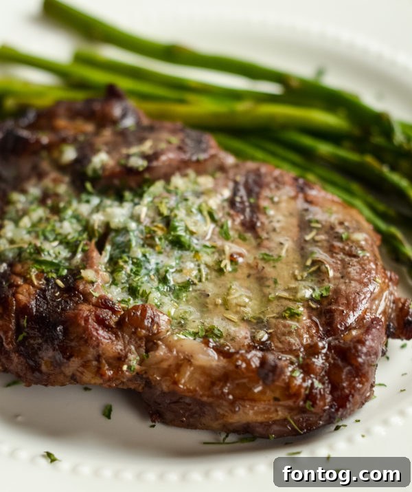 Perfectly grilled Garlic Butter Ribeyes on a serving platter