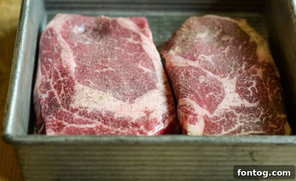Raw Angus Beef Ribeyes with generous marbling