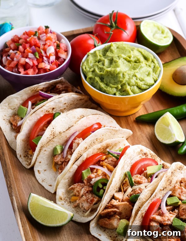 Ninja Foodi Chicken Tacos served with toppings