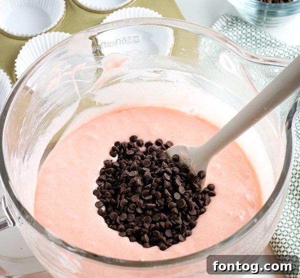 Variety of watermelon cupcakes with different frosting and liner colors
