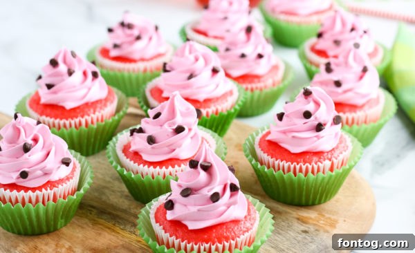 Frosted watermelon cupcakes arranged on a serving plate