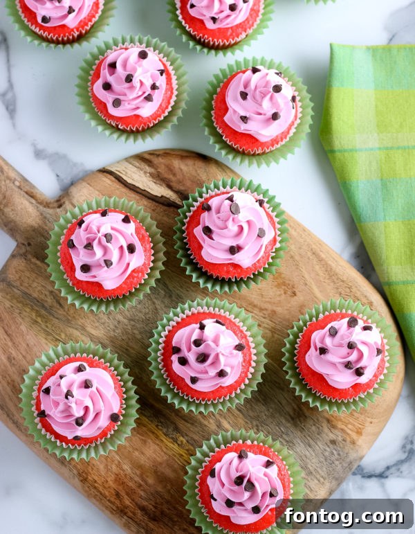 Group of decorated watermelon cupcakes with chocolate chip seeds